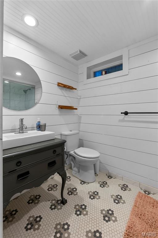 1658 County Road 435, Jackson, MO 63755 - bathroom with vanity, wood walls, and tile patterned floors