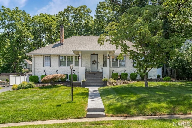 354 Frieda Ave, Kirkwood, MO 63122 - view of front of property featuring stone siding, a chimney, and a shingled roof
