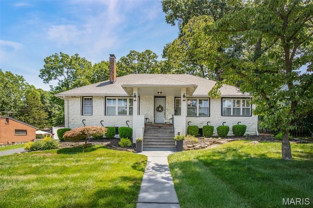 354 Frieda Ave, Kirkwood, MO 63122 - view of front of home featuring a chimney, a front lawn, stone siding, and a shingled roof