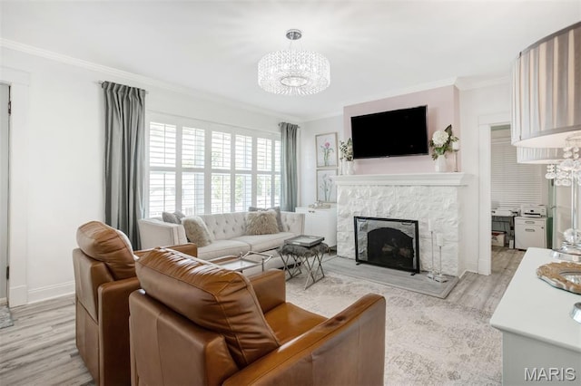 354 Frieda Ave, Kirkwood, MO 63122 - living area with a chandelier, crown molding, light wood finished floors, and a fireplace
