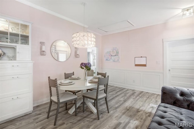 354 Frieda Ave, Kirkwood, MO 63122 - dining space featuring attic access, crown molding, and light wood finished floors