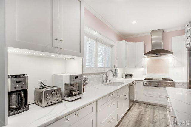 354 Frieda Ave, Kirkwood, MO 63122 - kitchen with wall chimney exhaust hood, appliances with stainless steel finishes, white cabinetry, light stone countertops, and crown molding