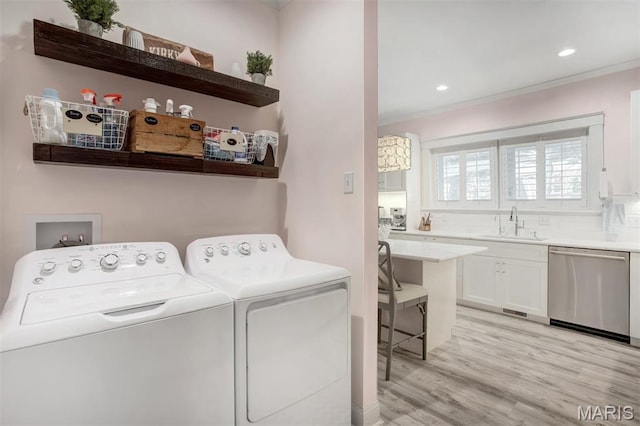 354 Frieda Ave, Kirkwood, MO 63122 - washroom featuring independent washer and dryer, ornamental molding, light wood finished floors, and recessed lighting
