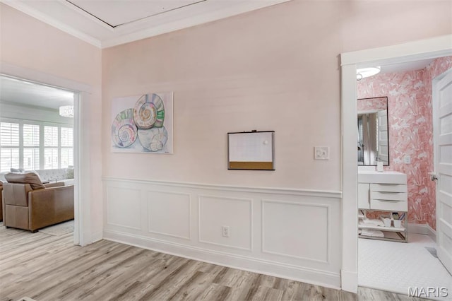 354 Frieda Ave, Kirkwood, MO 63122 - hall featuring light wood finished floors, ornamental molding, a wainscoted wall, and a decorative wall