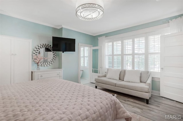 354 Frieda Ave, Kirkwood, MO 63122 - bedroom with ornamental molding and light wood finished floors