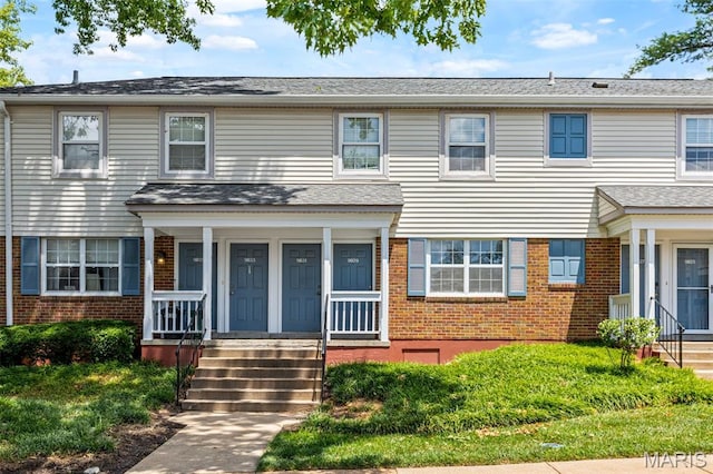 9029 N Swan Cir, Saint Louis, MO 63144 - traditional-style home with brick siding and a porch