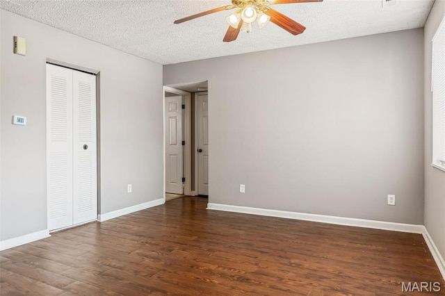 9029 N Swan Cir, Saint Louis, MO 63144 - unfurnished bedroom with wood finished floors, a closet, a textured ceiling, and a ceiling fan