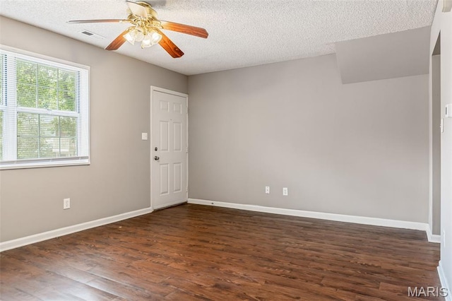 9029 N Swan Cir, Saint Louis, MO 63144 - unfurnished room featuring a textured ceiling, dark wood-style flooring, and ceiling fan