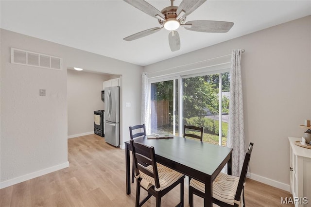 164 Burtonwood Dr, Ballwin, MO 63011 - dining space with ceiling fan and light wood finished floors