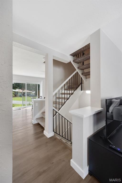 164 Burtonwood Dr, Ballwin, MO 63011 - stairs with wood finished floors and baseboards