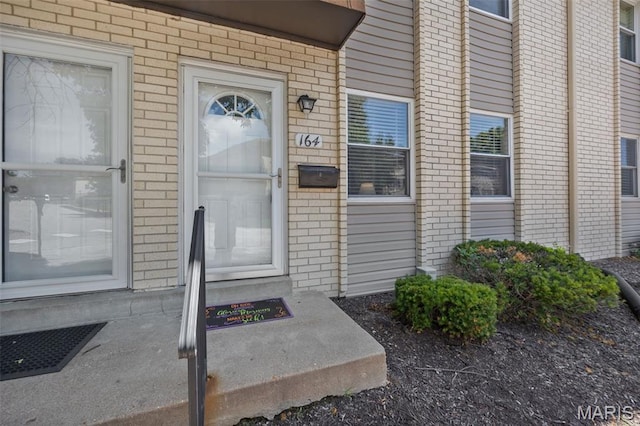 164 Burtonwood Dr, Ballwin, MO 63011 - doorway to property with brick siding