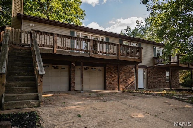 1688 Notre Dame Dr, Bonne Terre, MO 63628 - back of house featuring a garage, driveway, brick siding, and a chimney