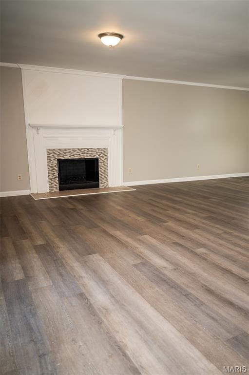 1688 Notre Dame Dr, Bonne Terre, MO 63628 - unfurnished living room with crown molding, dark wood-style flooring, and a fireplace