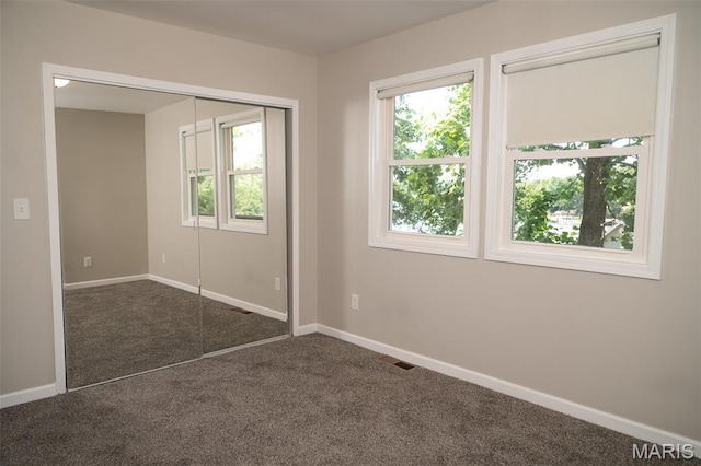 1688 Notre Dame Dr, Bonne Terre, MO 63628 - unfurnished bedroom featuring dark colored carpet and a closet
