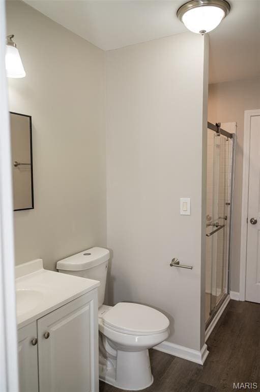 1688 Notre Dame Dr, Bonne Terre, MO 63628 - full bathroom with wood finished floors, vanity, and a stall shower