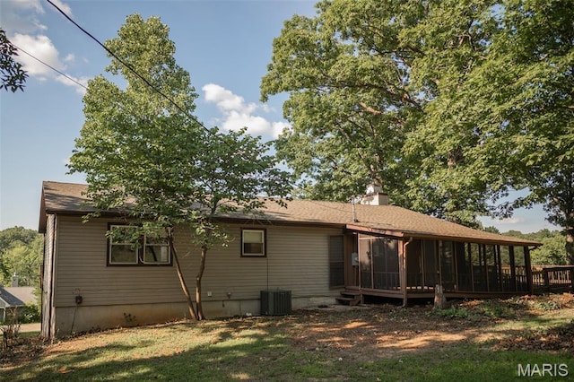 1688 Notre Dame Dr, Bonne Terre, MO 63628 - back of house featuring a sunroom, a chimney, and a yard