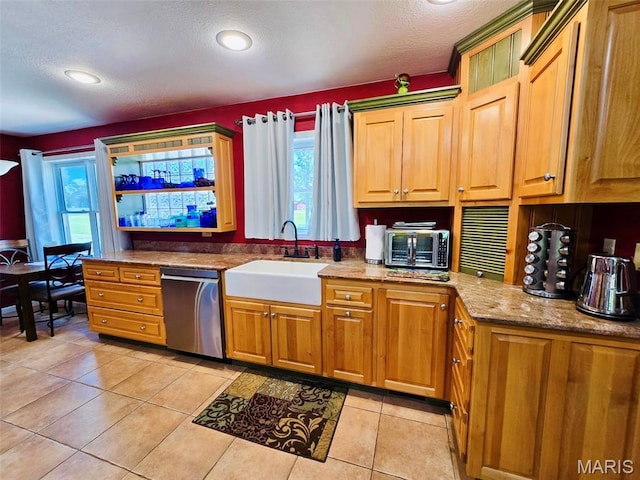 202 Maple, Licking, MO 65542 - kitchen featuring stainless steel dishwasher, a textured ceiling, light tile patterned flooring, light stone counters, and recessed lighting