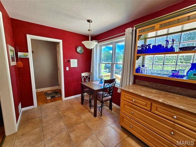 202 Maple, Licking, MO 65542 - dining room with a textured ceiling and light tile patterned floors