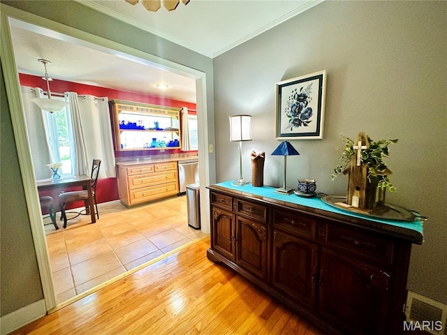 202 Maple, Licking, MO 65542 - hall with ornamental molding and light wood-style flooring