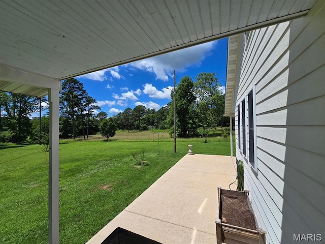 202 Maple, Licking, MO 65542 - view of green lawn featuring a patio area and view of scattered trees