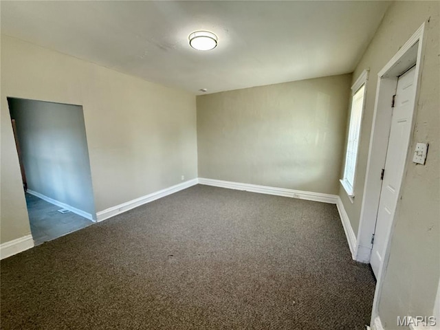 4652 Shirley Pl, Saint Louis, MO 63115 - unfurnished room with dark colored carpet and baseboards
