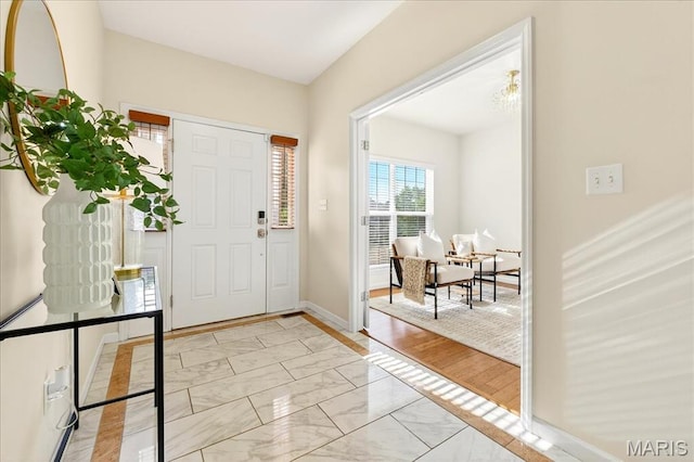 334 Lauren Lndg, Ballwin, MO 63021 - entryway featuring light marble finish flooring and baseboards