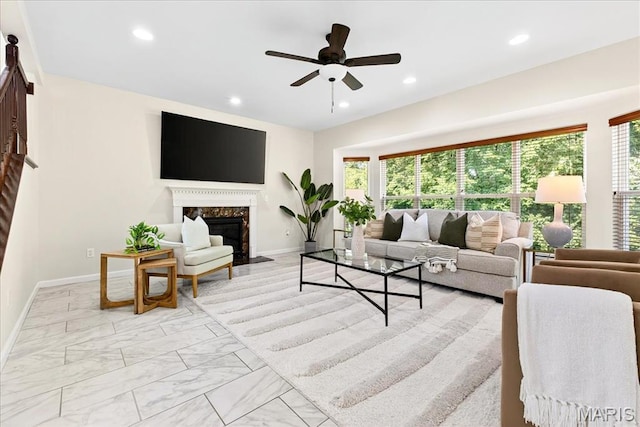 334 Lauren Lndg, Ballwin, MO 63021 - living area featuring plenty of natural light, a ceiling fan, recessed lighting, a fireplace, and light marble finish floors