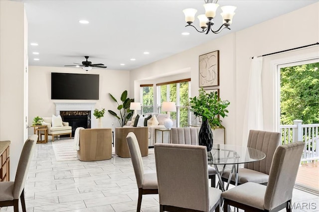 334 Lauren Lndg, Ballwin, MO 63021 - dining space featuring healthy amount of natural light, a premium fireplace, a ceiling fan, light marble finish floors, and recessed lighting