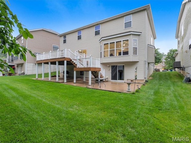 334 Lauren Lndg, Ballwin, MO 63021 - rear view of house with a patio, stairway, a wooden deck, and a lawn