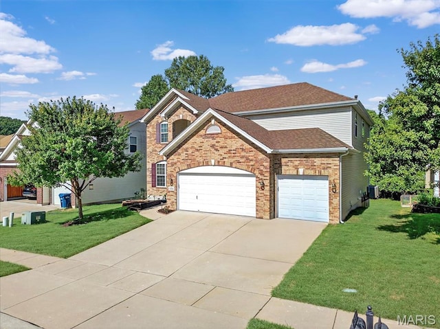 334 Lauren Lndg, Ballwin, MO 63021 - view of front of property with driveway, a front yard, an attached garage, and brick siding