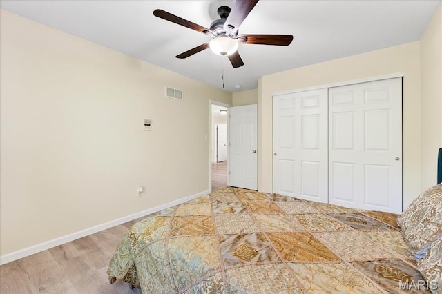 334 Lauren Lndg, Ballwin, MO 63021 - unfurnished bedroom featuring a closet, ceiling fan, and light wood-type flooring