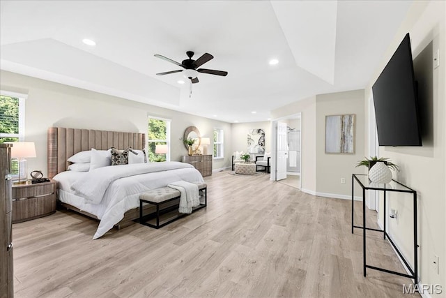 334 Lauren Lndg, Ballwin, MO 63021 - bedroom with a tray ceiling, light wood-style floors, multiple windows, recessed lighting, and ceiling fan