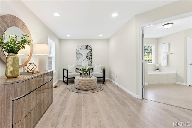 334 Lauren Lndg, Ballwin, MO 63021 - living area featuring light wood-type flooring, healthy amount of natural light, and recessed lighting