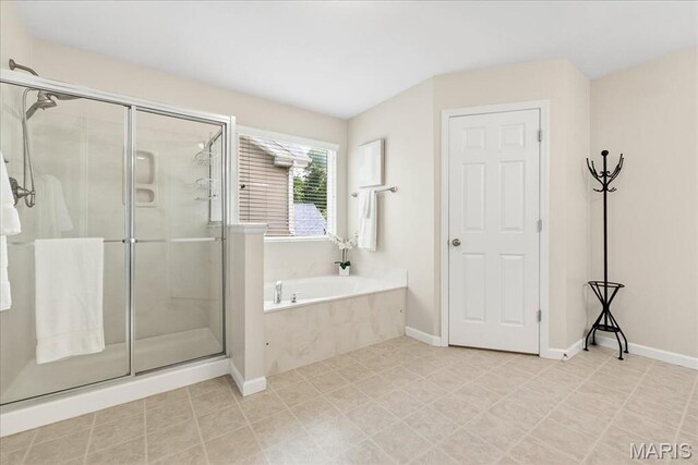 334 Lauren Lndg, Ballwin, MO 63021 - full bathroom featuring a bath and a shower stall