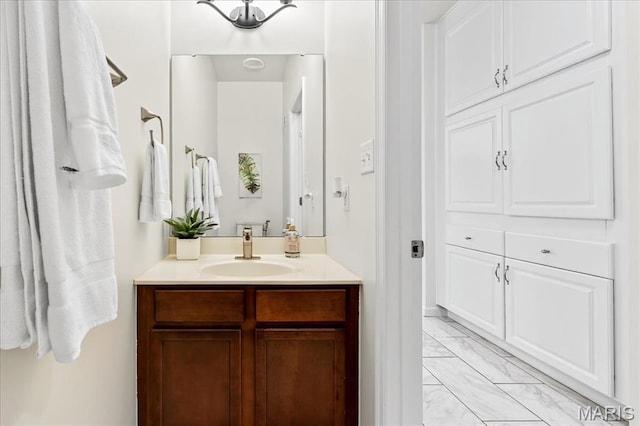 334 Lauren Lndg, Ballwin, MO 63021 - bathroom featuring marble look tile flooring and vanity