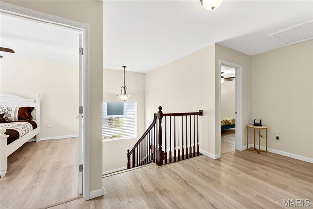 334 Lauren Lndg, Ballwin, MO 63021 - hall featuring wood finished floors and an upstairs landing