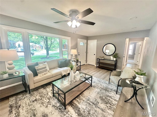 1226 Oakleaf Dr, Saint Louis, MO 63119 - living room with wood finished floors, healthy amount of natural light, and a ceiling fan