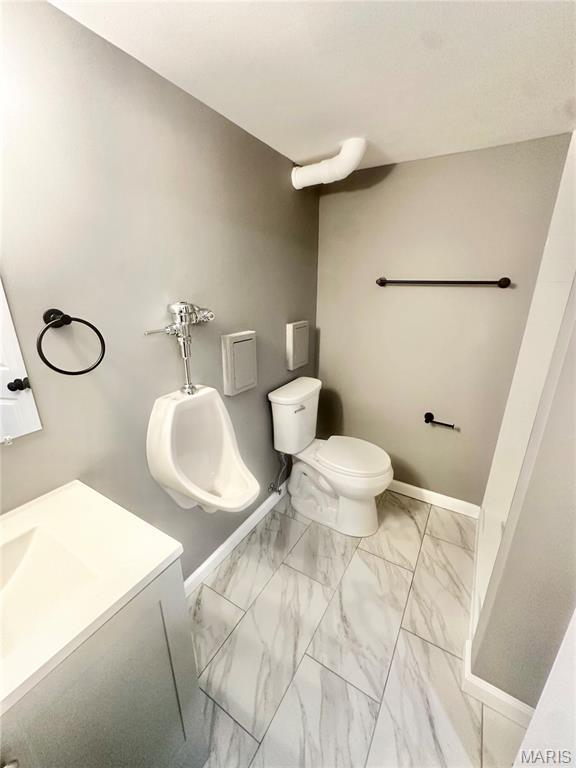 1226 Oakleaf Dr, Saint Louis, MO 63119 - bathroom with vanity and marble look tile flooring