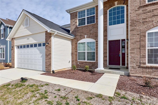 17603 Hitching Post Ct, Eureka, MO 63025 - view of front of home with brick siding, driveway, and an attached garage