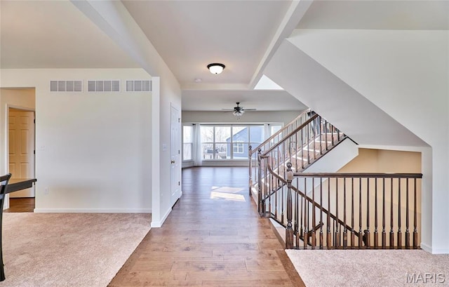 17603 Hitching Post Ct, Eureka, MO 63025 - hallway with stairs, wood finished floors, and carpet floors