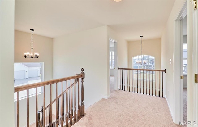 17603 Hitching Post Ct, Eureka, MO 63025 - corridor featuring a chandelier, an upstairs landing, and carpet floors
