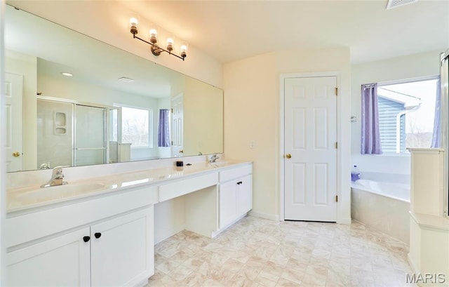 17603 Hitching Post Ct, Eureka, MO 63025 - full bathroom with a garden tub, double vanity, and a shower stall