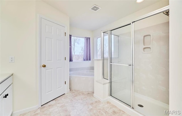 17603 Hitching Post Ct, Eureka, MO 63025 - bathroom featuring vanity, a bath, and a stall shower