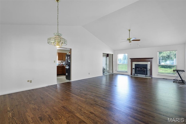 3816 Keeneland Ct, Florissant, MO 63034 - unfurnished living room featuring healthy amount of natural light, ceiling fan, wood finished floors, and high vaulted ceiling