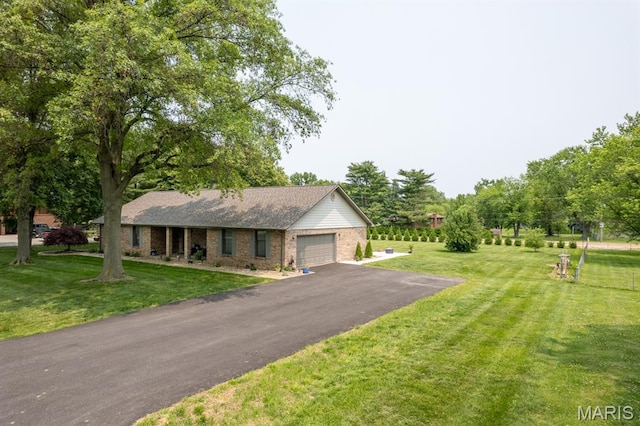 616 E Brentmoor Dr, Troy, IL 62294 - single story home with brick siding, a front lawn, a garage, and driveway