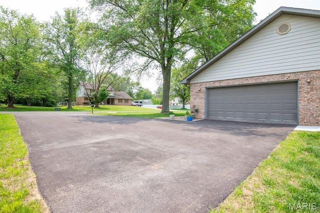 616 E Brentmoor Dr, Troy, IL 62294 - garage with asphalt driveway
