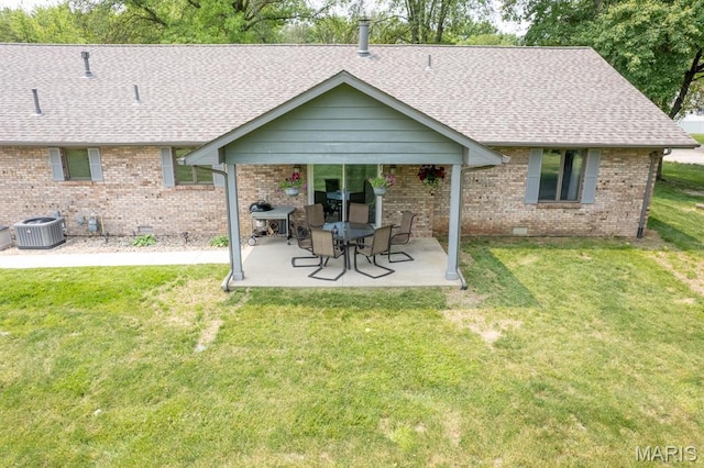616 E Brentmoor Dr, Troy, IL 62294 - back of property with a shingled roof, brick siding, and a patio area