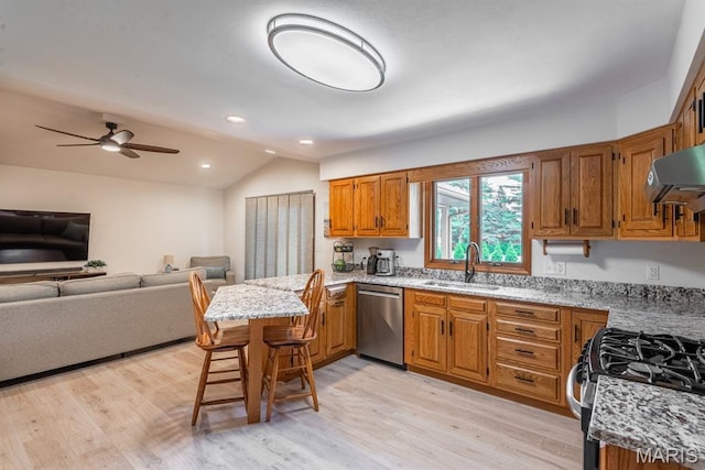 616 E Brentmoor Dr, Troy, IL 62294 - kitchen with appliances with stainless steel finishes, vaulted ceiling, a peninsula, brown cabinets, and light stone counters