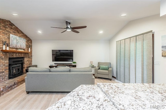 616 E Brentmoor Dr, Troy, IL 62294 - living area with vaulted ceiling, light wood-type flooring, ceiling fan, recessed lighting, and a fireplace