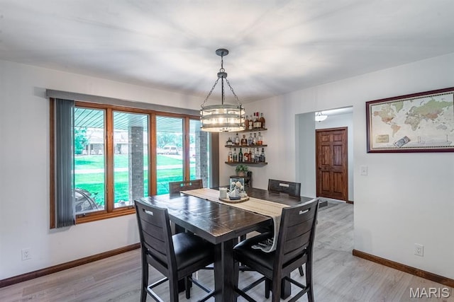 616 E Brentmoor Dr, Troy, IL 62294 - dining room with light wood-style flooring and a chandelier
